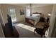 Cozy main bedroom with a door to an outdoor deck and natural light at 7503 E Cherokee Dr, Canton, GA 30115