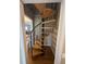 Unique spiral staircase with wooden steps and black metal railing at 7503 E Cherokee Dr, Canton, GA 30115