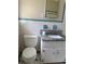 Bathroom with a granite countertop vanity, mirror, toilet, and blue accents at 3153 Lake Monroe Rd, Douglasville, GA 30135