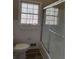 Clean bathroom with a shower-tub combo and a window at 3153 Lake Monroe Rd, Douglasville, GA 30135