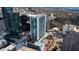 Aerial view of a high-rise building with a rooftop pool in a vibrant urban setting at 3324 Peachtree Ne Rd # 1510, Atlanta, GA 30326