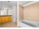 Bright bathroom features a tub and shower combination and a granite-topped vanity at 3324 Peachtree Ne Rd # 1510, Atlanta, GA 30326