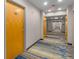 Hallway with apartment doors, carpet and lighting at 3324 Peachtree Ne Rd # 1510, Atlanta, GA 30326