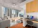 Bright, open living room featuring hardwood floors, concrete ceilings, and large windows with stunning city views at 3324 Peachtree Ne Rd # 1510, Atlanta, GA 30326