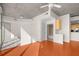 Open living area with hardwood floors leading to a bathroom and kitchen in a modern-designed home at 3324 Peachtree Ne Rd # 1510, Atlanta, GA 30326