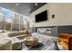 Spacious lounge with comfortable seating, fireplace, and expansive windows at 3324 Peachtree Ne Rd # 1510, Atlanta, GA 30326