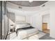Serene main bedroom suite with neutral tones, a large window, and a glimpse into an ensuite bathroom at 3324 Peachtree Ne Rd # 1510, Atlanta, GA 30326
