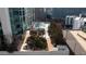 Overhead view featuring pool, outdoor seating, a pergola, and lush landscaping on the rooftop at 3324 Peachtree Ne Rd # 1510, Atlanta, GA 30326