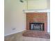 Close-up view of the traditional brick fireplace featuring a white mantle at 440 Cottonpatch Rd, Lawrenceville, GA 30046