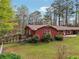Backyard featuring a well-maintained lawn, a wooden deck, and mature trees at 738 Lauren Cir, Lawrenceville, GA 30043