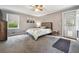 Cozy bedroom with a comfortable bed, soft carpet, and natural light at 738 Lauren Cir, Lawrenceville, GA 30043
