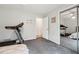 Bedroom with exercise equipment and mirrored closet at 738 Lauren Cir, Lawrenceville, GA 30043