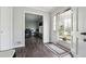 Bright entryway featuring hardwood floors and view to the dining room through an open doorway at 738 Lauren Cir, Lawrenceville, GA 30043