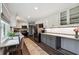 Well-lit kitchen with stainless steel appliances, granite countertops, and a breakfast bar at 738 Lauren Cir, Lawrenceville, GA 30043