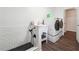 Bright laundry room featuring a modern washer, dryer, and a convenient pet washing station at 738 Lauren Cir, Lawrenceville, GA 30043