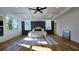 Bright bedroom with a tray ceiling, hardwood floors, decorative rug, and a dark accent wall at 1102 Morley Se Ave, Atlanta, GA 30312