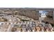 Aerial of neighborhood featuring many single-Gathering homes and natural wooded area at 1555 Diplomat Dr, Cumming, GA 30041