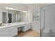 Bathroom featuring double vanity, shower, and a large mirror is designed for comfort and style at 1555 Diplomat Dr, Cumming, GA 30041