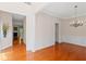 Elegant dining room featuring hardwood floors, crown molding, and chandelier at 1555 Diplomat Dr, Cumming, GA 30041
