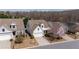 View of a home in a neighborhood; well-maintained front lawn with blooming tree at 1555 Diplomat Dr, Cumming, GA 30041