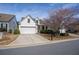 A beautiful home with a well-kept lawn and an attached two-car garage at 1555 Diplomat Dr, Cumming, GA 30041