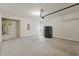 The spacious garage features a concrete floor, a refrigerator, and a water heater at 1555 Diplomat Dr, Cumming, GA 30041