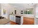 Well-lit kitchen featuring stainless steel appliances, generous countertop space, and hardwood flooring at 1555 Diplomat Dr, Cumming, GA 30041