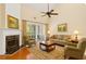 Inviting living room with fireplace, comfortable seating, and sliding glass doors at 1555 Diplomat Dr, Cumming, GA 30041
