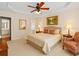 Comfortable bedroom with a queen-sized bed, an ensuite, and a ceiling fan at 1555 Diplomat Dr, Cumming, GA 30041