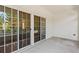 This patio features sliding glass doors and white siding at 1555 Diplomat Dr, Cumming, GA 30041