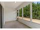 The sunroom features a wall of windows and white siding at 1555 Diplomat Dr, Cumming, GA 30041