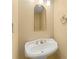A charming bathroom with a vintage-style pedestal sink, elegant fixtures, and a well-lit mirror at 7438 Chilton Ln, Riverdale, GA 30296