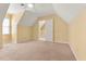 The bedroom has carpet flooring, a ceiling fan, and access to another room at 7438 Chilton Ln, Riverdale, GA 30296