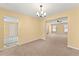Bright dining room with chandelier that is attached to the living room at 7438 Chilton Ln, Riverdale, GA 30296