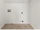 Laundry room featuring tile floor and the hookups needed to easily install a washer and dryer at 7438 Chilton Ln, Riverdale, GA 30296