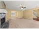 Open living room featuring a fireplace and view to the staircase and dining room at 7438 Chilton Ln, Riverdale, GA 30296