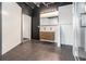 Modern bathroom featuring a double vanity, tiled walls, and a glass-enclosed shower, perfect for a stylish urban home at 878 Peachtree Ne St # 711, Atlanta, GA 30309
