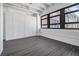 Well-lit bedroom featuring a large window with views, sleek floors, and closet, perfect for urban living at 878 Peachtree Ne St # 711, Atlanta, GA 30309