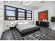 Contemporary bedroom with a large window, modern decor, and monochrome color scheme at 878 Peachtree Ne St # 711, Atlanta, GA 30309