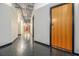 Long hallway with exposed pipes and modern lighting leads to various units; perfect for commercial or residential use at 878 Peachtree Ne St # 711, Atlanta, GA 30309