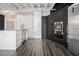 Stylish kitchen with stainless steel appliances, modern white and black cabinets, and sleek design at 878 Peachtree Ne St # 711, Atlanta, GA 30309
