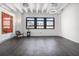Bright, airy living room with large windows and sleek hardwood floors, offering a stylish and comfortable space at 878 Peachtree Ne St # 711, Atlanta, GA 30309