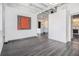 Open-concept living area showcasing modern art, sleek floors, and a view into the kitchen, perfect for urban living at 878 Peachtree Ne St # 711, Atlanta, GA 30309