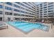 Community swimming pool featuring lounge chairs, offering a resort-like experience at 878 Peachtree Ne St # 711, Atlanta, GA 30309