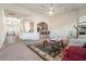 Open-concept living room featuring a fireplace, with seamless flow to the kitchen and dining area at 20 Gentle Spring Ln, Covington, GA 30016