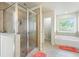 Bathroom with a walk-in shower, soaking tub, and tiled floors at 4050 Ironwood Dr, Atlanta, GA 30349