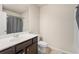Bathroom with a vanity with dark cabinets, a toilet, and a shower at 4050 Ironwood Dr, Atlanta, GA 30349