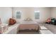 Large bedroom with two windows, plush carpet flooring, and lots of space for different furnishings at 4050 Ironwood Dr, Atlanta, GA 30349