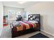 Comfortable bedroom with carpet floors, a modern bed frame, and natural light from a window at 4050 Ironwood Dr, Atlanta, GA 30349