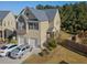 Charming two-story home with stone accents, two-car garage, and a well-manicured lawn at 4050 Ironwood Dr, Atlanta, GA 30349